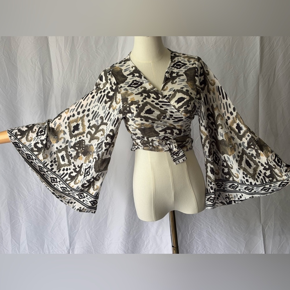 Chic Patterned Wrap Blouse With Bell Sleeves - image 1